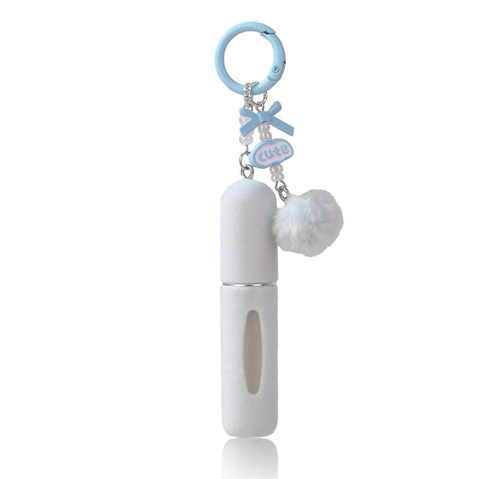 Blue plush perfume atomiser keychain with refillable spray bottle and pom pom charm