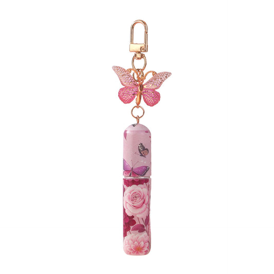 Pink floral mini perfume atomizer keychain with butterfly charm and rose pattern bottle