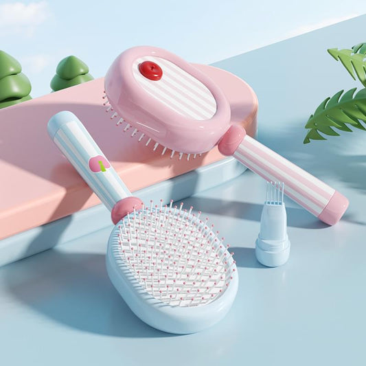 Three-piece hair brush set with pink air-cushion brush, blue comb brush, and separate bristle head.