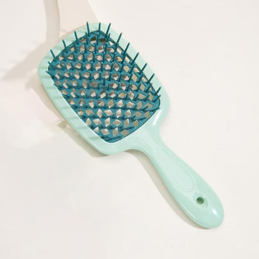 Hair detangling paddle brush with mint handle and teal vented bristle pad