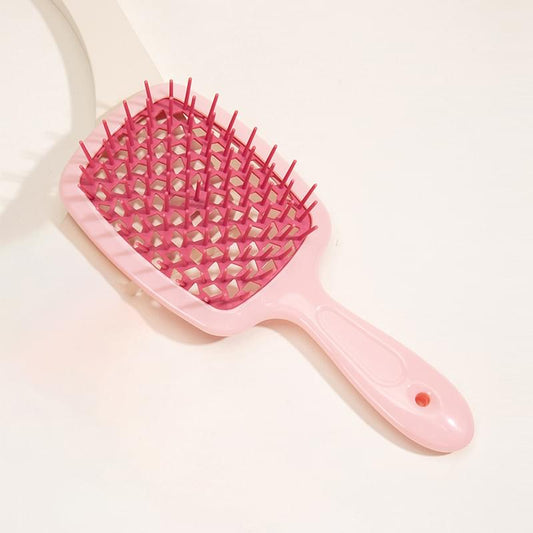 Pink detangling hair brush with vented cushioned base and soft bristle teeth