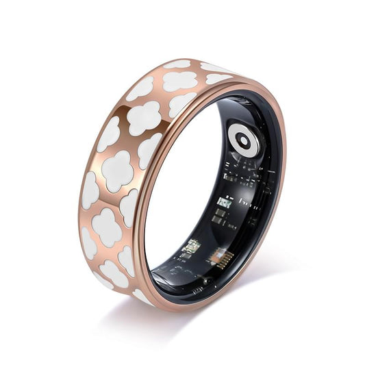 Smart health ring with clover-pattern band and dark display, rose gold finish