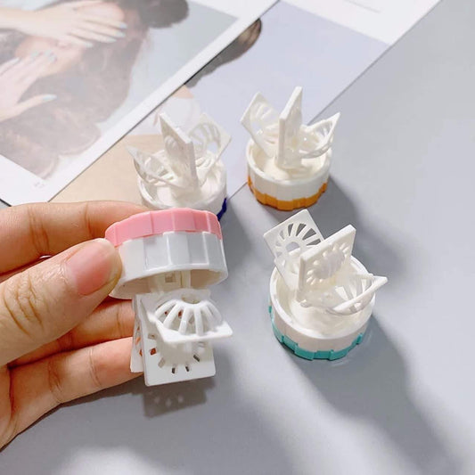 Lens cleaning case kit with open compartments and rotating white insert