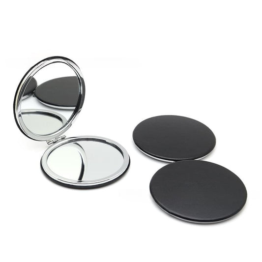 Round pocket makeup mirror with black hinged cover and metal frame, closed