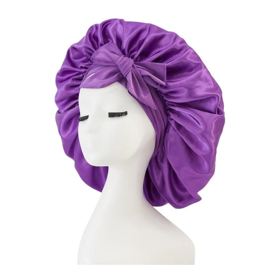 Purple satin sleep bonnet with wide band and side bow tie