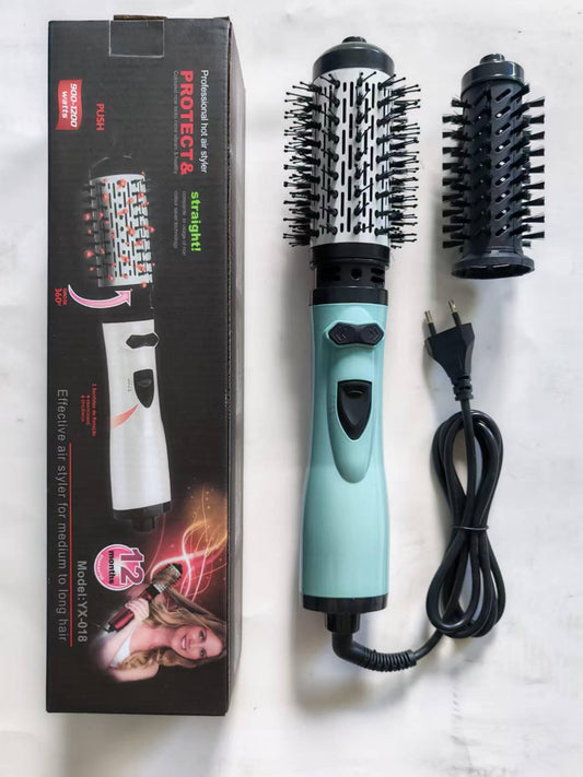 Hair styling hot air brush with teal handle, rotating barrel, and power cord
