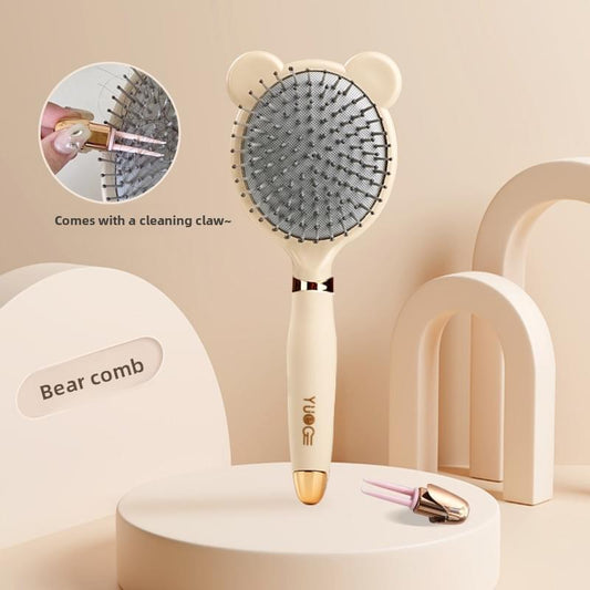 Hair brush with gray air-cushion pad, long pins, cream bear-ear handle