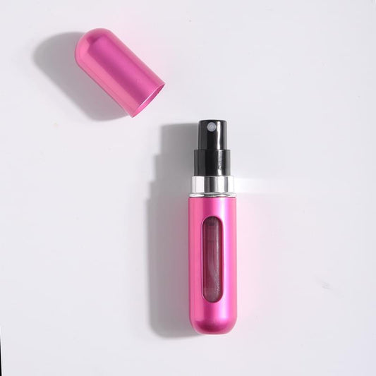 Rose red refillable perfume atomizer bottle with spray nozzle and protective cap