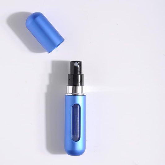 Blue refillable perfume atomizer with black spray pump and blue protective cap