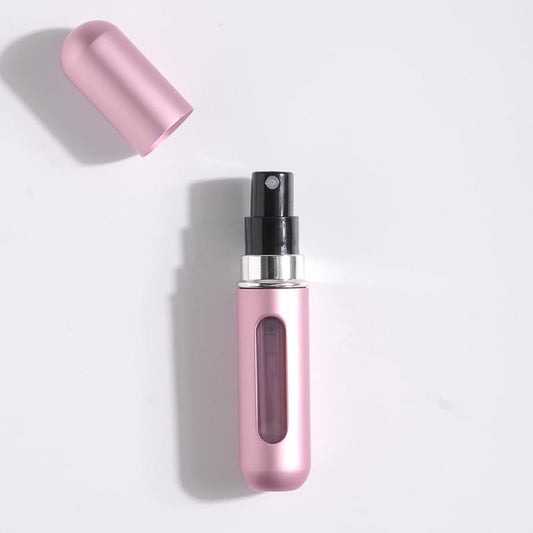 Pink refillable perfume atomizer with spray nozzle and protective cap