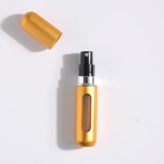 Gold refillable perfume atomizer with cap and spray nozzle, compact travel bottle