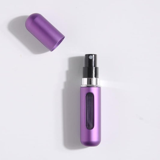 Refillable perfume atomizer, purple metallic body with spray nozzle, cap removed