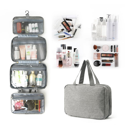 Gray hanging toiletry bag with four fold sections and a clear wet compartment