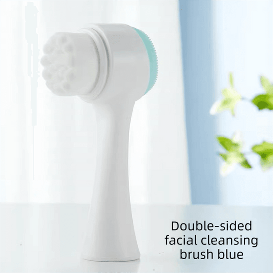 Facial cleansing brush with blue silicone scrubber head on white handle