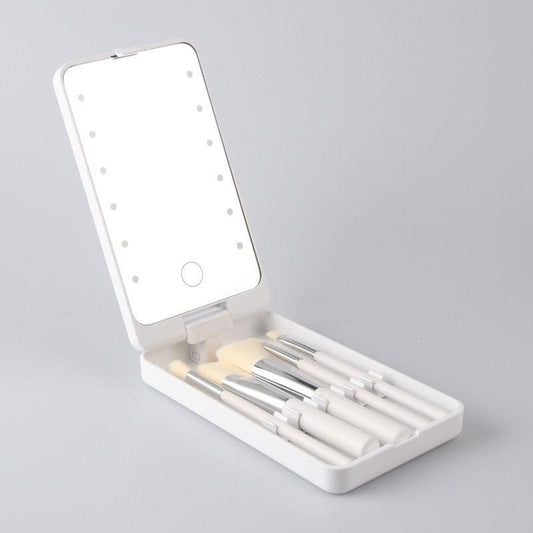 White foldable vanity mirror with LED light dots and makeup brush storage tray