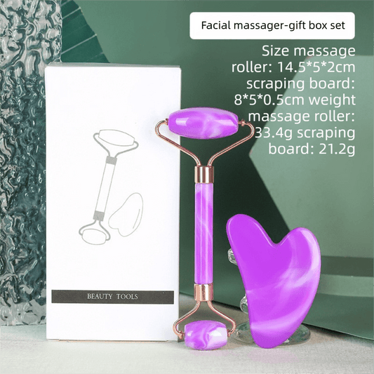 Purple resin facial massage roller and heart-shaped gua sha set for face and neck