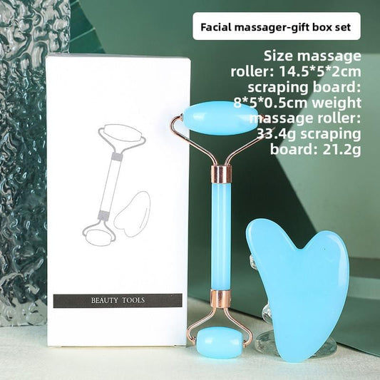 Blue resin dual-head facial roller and heart gua sha set with gold-tone handles