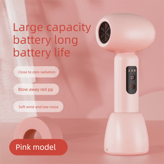 Pink baby hair dryer with round nozzle and black control button panel