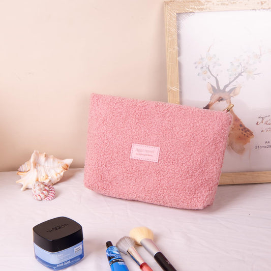 Pink teddy fleece cosmetic pouch with zip closure, rectangular shape