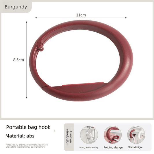 Burgundy foldable bag hook, circular clip for table edge holding.