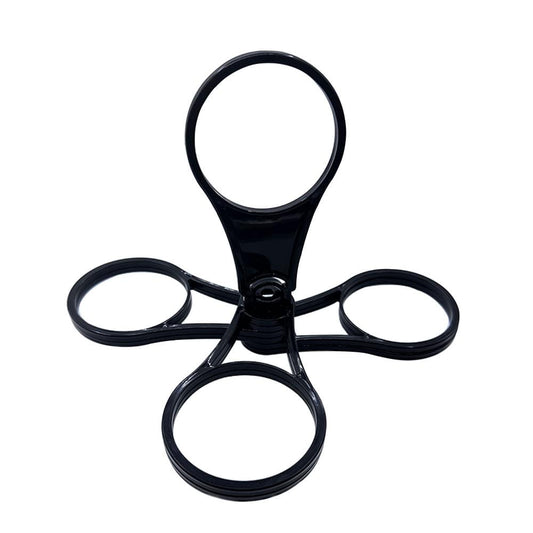 Black drink carrier with ring grips and central hub for cups