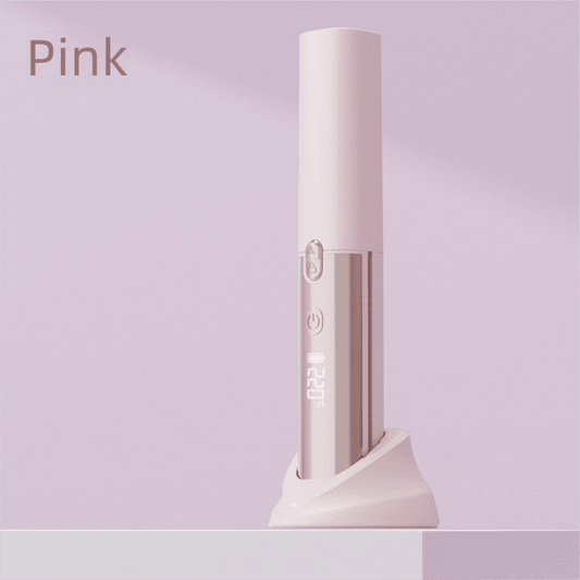 Pink 2-in-1 wireless hair styler with comb, upright base.