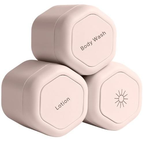 Pink magnetic cosmetic containers, labeled Body Wash and Lotion with sun icon
