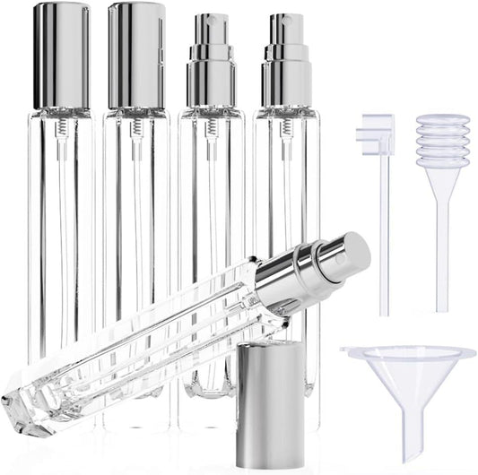 Glass perfume atomizer set with silver caps and clear bottles, plus transfer tools