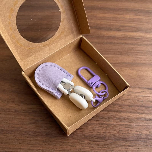 Mini precision scissors set with safety cap, purple case, and keychain hook
