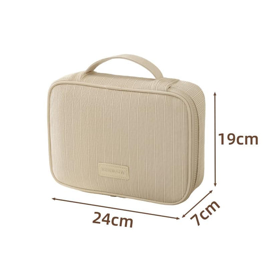 Beige travel makeup bag with top handle and zippered rectangular case, textured fabric