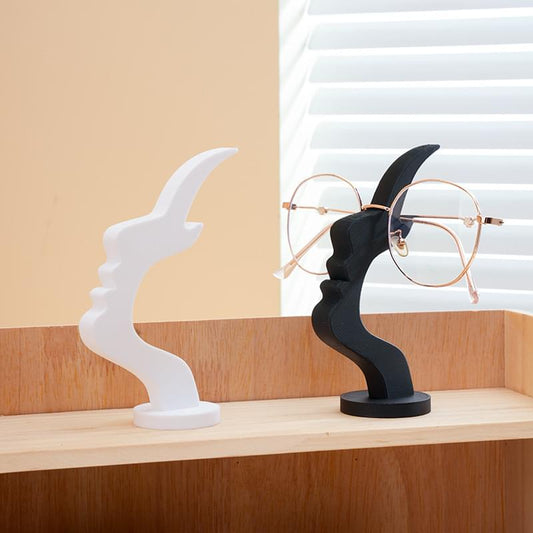 Two-piece eyeglass holder set: white and black stands with eyeglasses