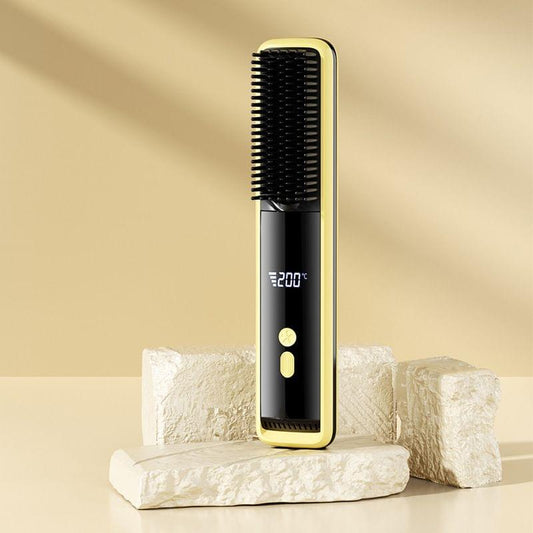 Yellow hair straightener brush with comb teeth and LCD showing 200°C heat level