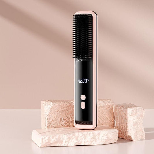 Pink hair straightener brush with LCD showing 200°C and black comb bristles.