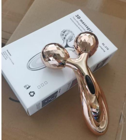 V-shaped facial roller massager with two rose-gold ball heads and curved handle