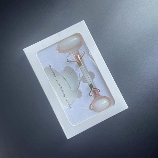 Two-piece gua sha facial tool set in pale rose quartz, heart and curved shapes
