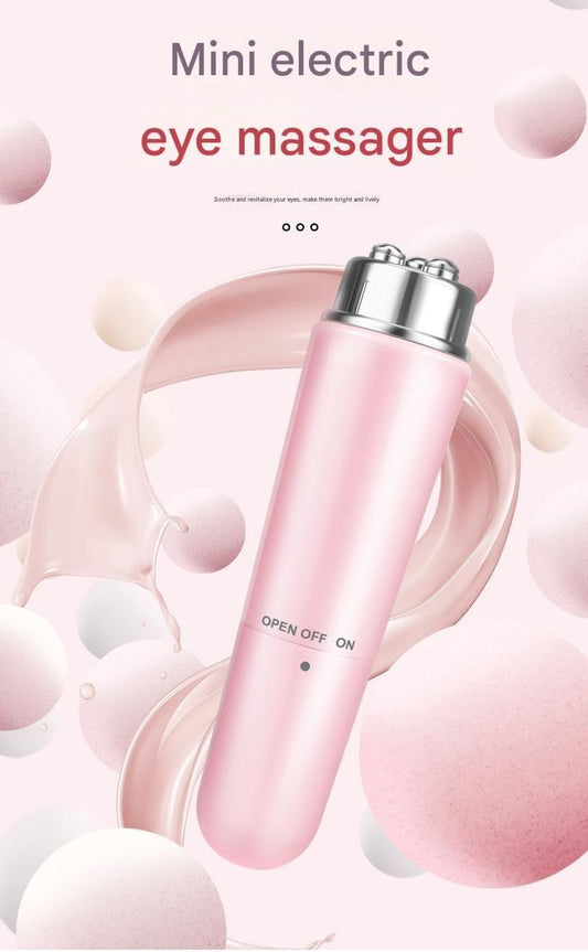 Pink mini electric eye massager pen with metal top and power controls