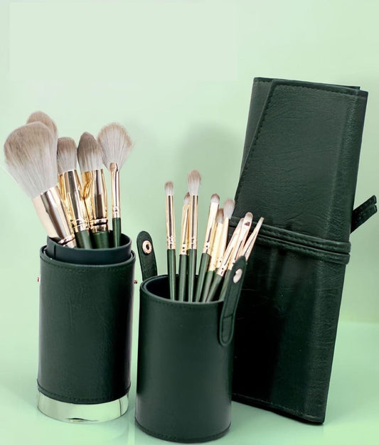 Green fabric storage bucket with makeup brushes and a folded brush case