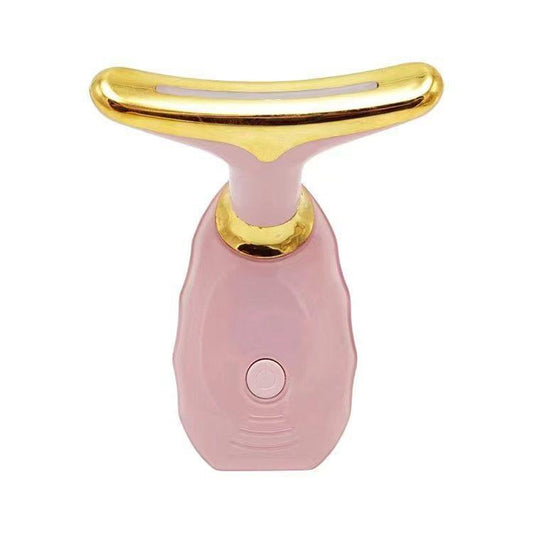 Pink neck and face massager with gold-toned head and round power button
