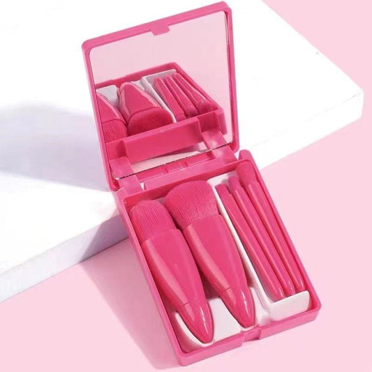 Compact makeup brush set in pink travel case with five synthetic brushes