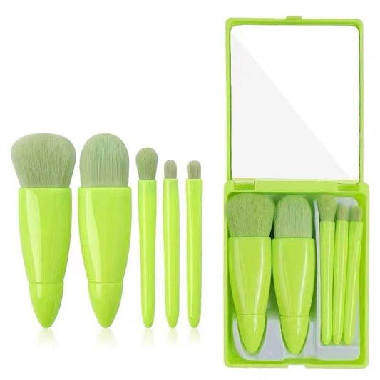 Green compact makeup brush set with mirror and five mini synthetic brushes in case