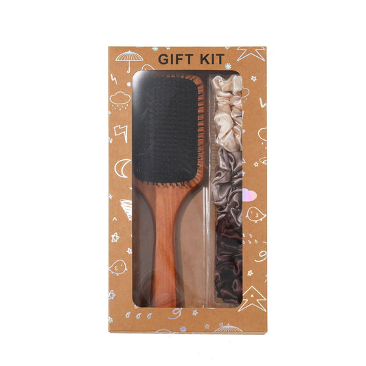 Hair brush gift set box with dark paddle brush and satin scrunchies, front view