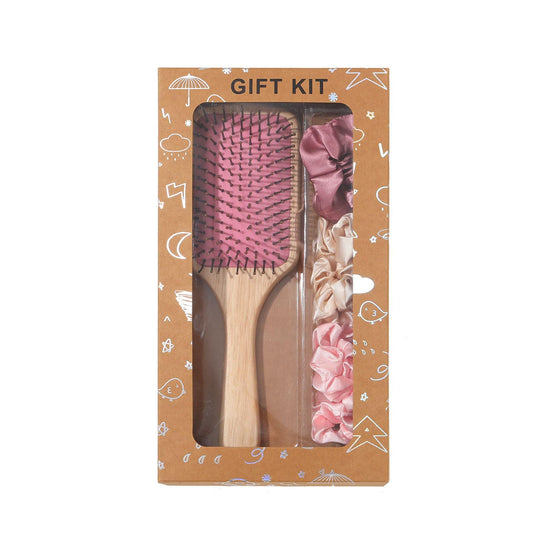 Hair brush gift kit in box with cushion paddle brush and satin scrunchies, pink tones