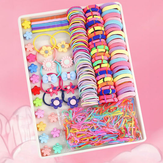 Kids hair elastic set in box with flower-shaped ties, rainbow bands, and colorful charms