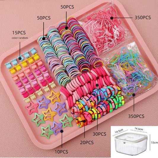Hair accessories set in pink organizer tray with colorful elastic bands and hair clips