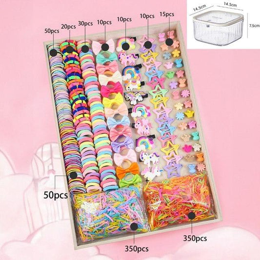 Hair accessories set in box: colorful elastic bands, bows, clips, and star pieces.