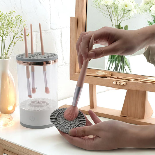 Makeup brush cleaning machine with spinning brush pad and vertical drying tubes