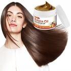 Hair oil application with batana oil jar near long dark hair, side view.
