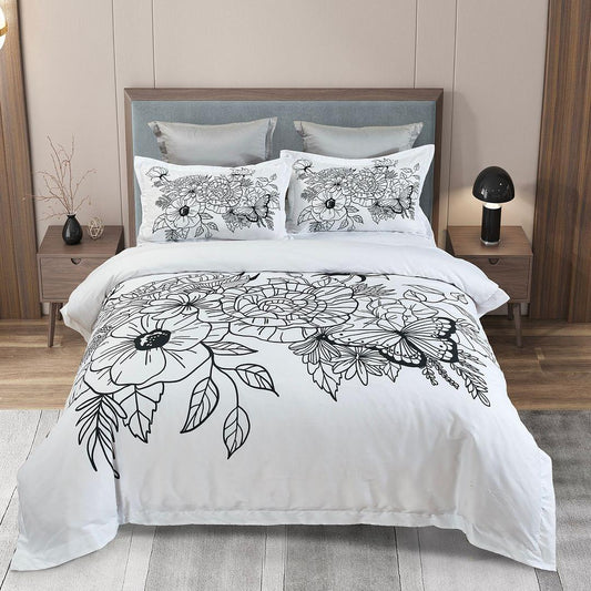 Floral quilt cover set in white with black line-art flowers and matching pillowcases