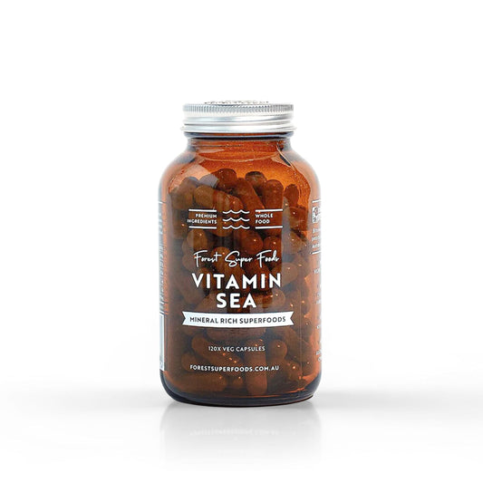 Vitamin Sea supplement bottle, dark amber capsules inside, silver screw lid label