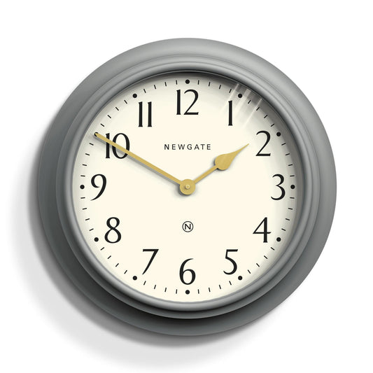 Grey wall clock close-up with white dial, gold hands and Arabic numerals